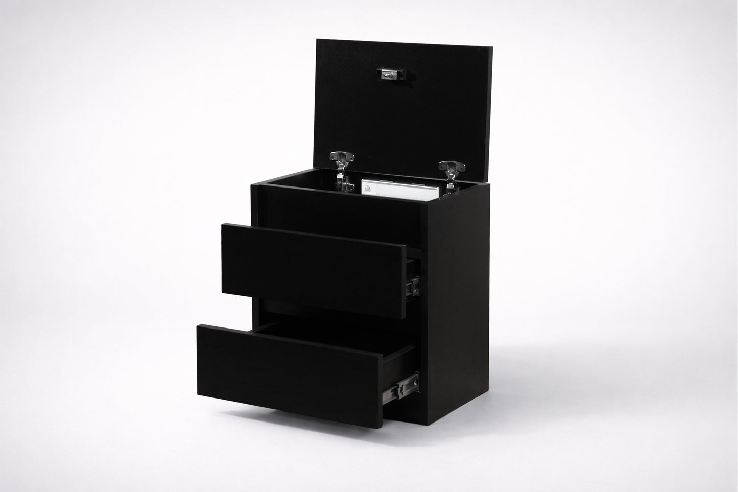 Black vanity unit with open top drawer on a white background
