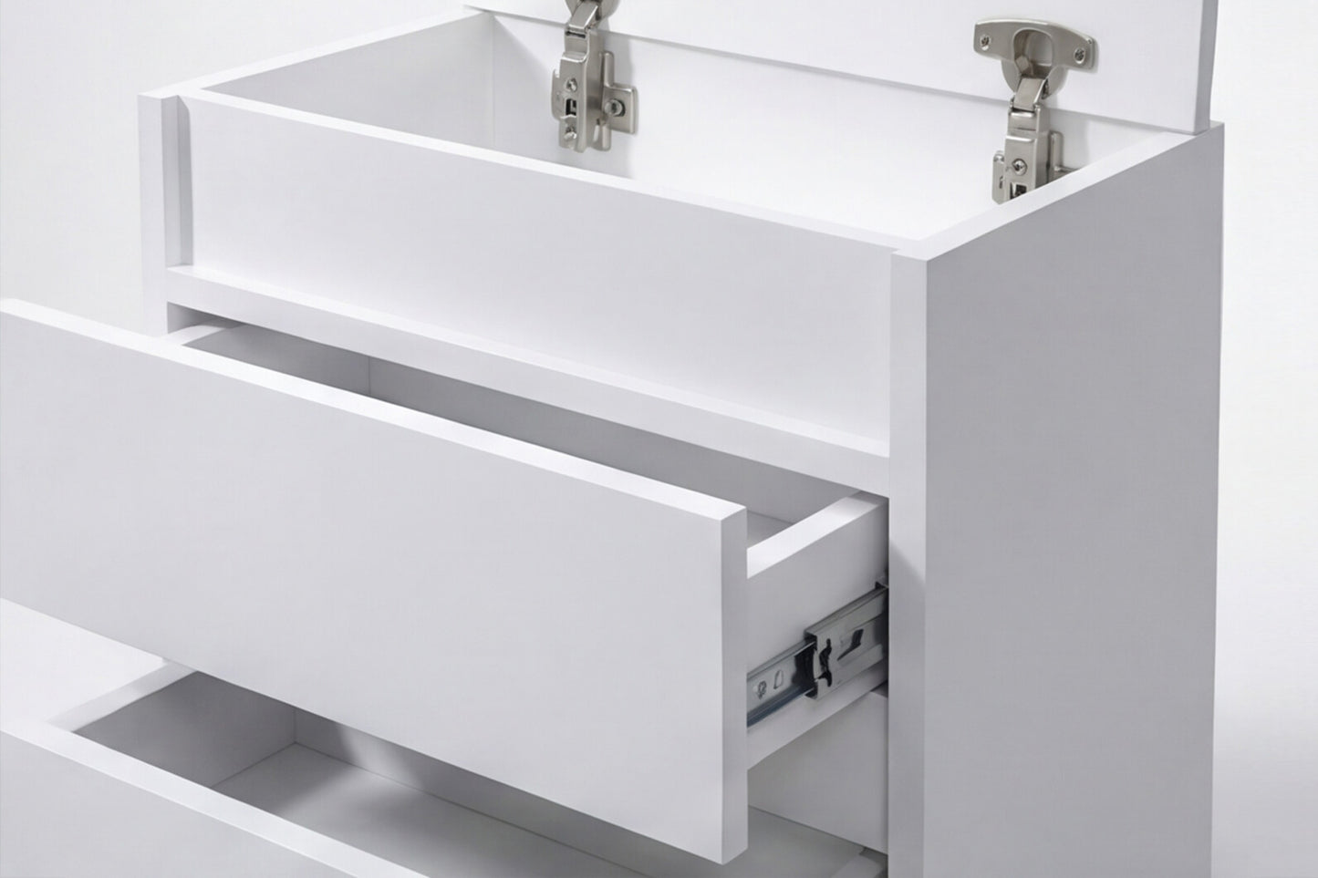 White cabinet with open drawer and visible hinges on a white background